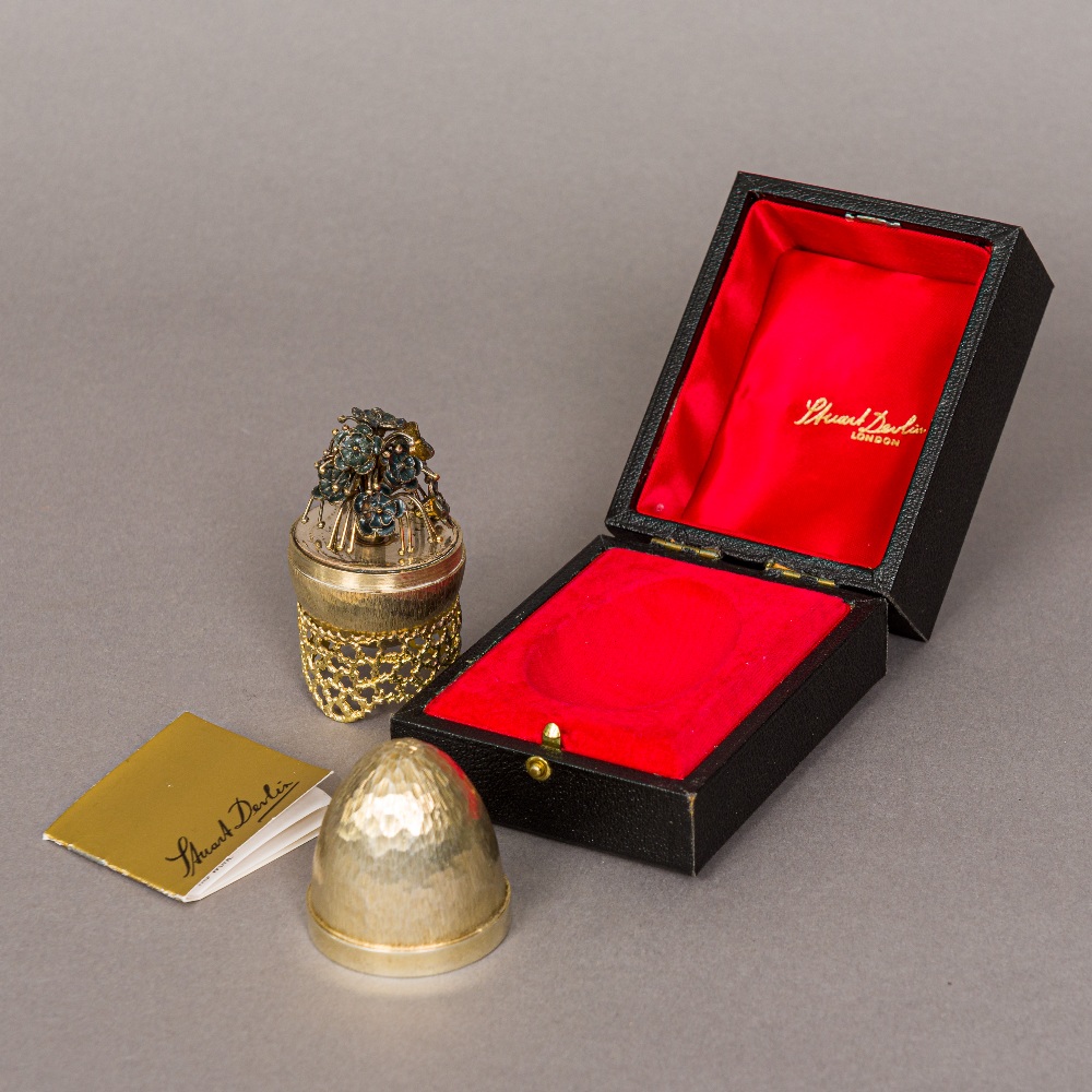 STUART DEVLIN silver gilt egg, hallmarked London 1979 Enclosing a spray of enamel decorated flowers,