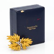 A Tiffany & Co 18 ct gold and diamond brooch Of floral spray form, housed in a Tiffany & Co box. 4.
