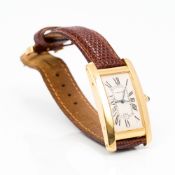 An Art Deco style 18 ct gold Cartier wristwatch Of curved rectangular form,