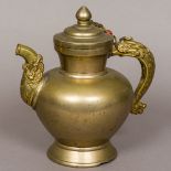A 19th century Tibetan ewer Modelled with a dragon and spout. 24 cm high.