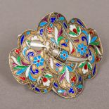 A Russian enamel decorated silver buckle Decorated with scrolling foliate design,