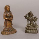 A small Tibetan copper figure of a female attendant Together with a small bronze figure of a seated