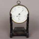 A Victorian Newton & Co lacquered brass cased aneroid barometer Of circular form,
