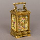 A small lacquered brass cased painted porcelain set carriage clock The angular handle above the