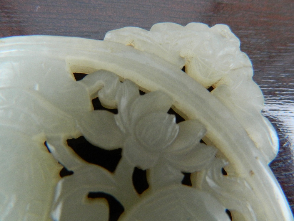 A Chinese pierced and carved jade roundel Centrally decorated with two young boys, - Image 12 of 13