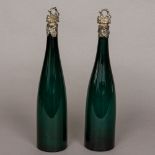 A pair of 19th century silver plate mounted green glass bottles Each with fruiting vine cast neck