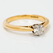 An 18 ct gold diamond solitaire ring The claw set stone approximately 0.25 carat.