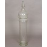 A 19th century clear glass storage jar, possibly an apothecary jar Of cylindrical form,