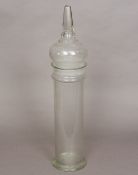 A 19th century clear glass storage jar, possibly an apothecary jar Of cylindrical form,