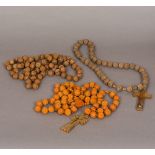 Three carved sets of rosary beads The longest 110 cm long.