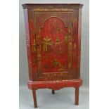 A mid-18th century red japanned hanging corner cupboard (now on later stand) The moulded cornice