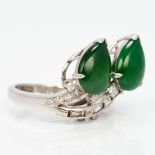 A Chinese 18 ct white gold jade and diamond set ring 1.5 cm high.