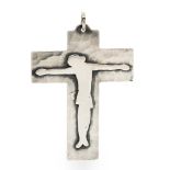 A Jean Despres unmarked silver pendant Formed as a crucifix, the reverse signed. 7 cm high.