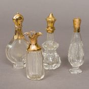 Four 19th century Continental gold mounted cut glass scent bottles One etched with Pope Pius IX.
