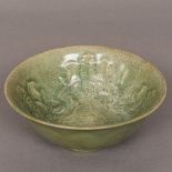 A Chinese crackle glaze celadon bowl Of flared form, with interior decoration,
