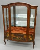 A late 19th/early 20th century French ormolu mounted Vernis Martin style display cabinet The arched