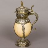 A 19th century unmarked silver mounted stein The main body formed from an ostrich egg with embossed