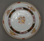 An 18th century Chinese porcelain plate Decorated with gilt heightened pomegranates.