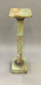 A late 19th century French gilt metal mounted green onyx column The square top supported on a