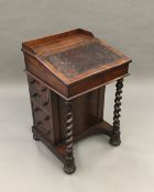 A William IV rosewood Davenport The rectangular top with solid three quarter gallery above the