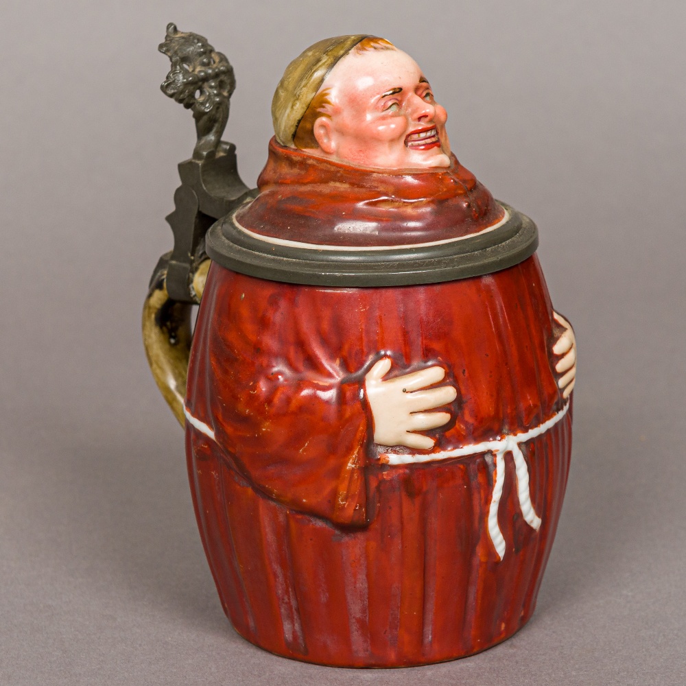 A 19th century Continental porcelain stein Formed as a monk,
