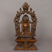 A patinated bronze figure of Buddha Modelled seated in the lotus position on a stepped plinth base