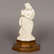 A late 19th/early 20th century Indian carved ivory figure Modelled as a young woman with naked