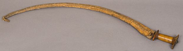 A 19th century Ethiopian sabre in scabbard Set with rhino horn hilt. 93 cm long.