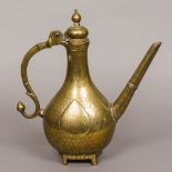 An 18th century Mughal bronze pear shaped ewer With teardrop cartouche and straight spout,
