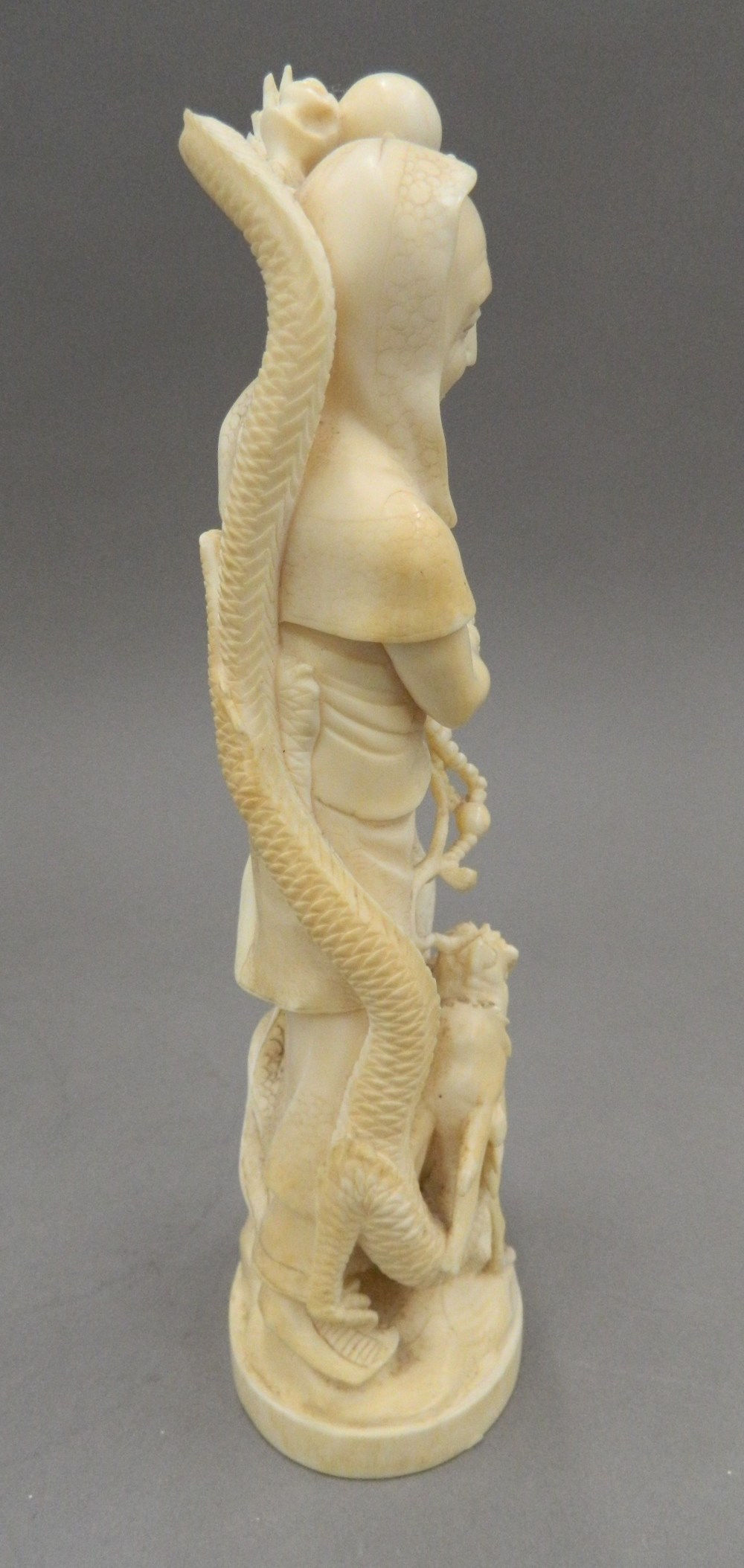 A late 19th century Japanese carved okimono Formed as a robed figure and a dragon, - Image 4 of 13