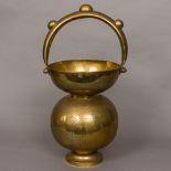 An Indian engraved brass bucket Of double gourd form with nodular loop handle,