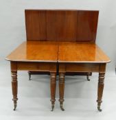 A 19th century eight-leg mahogany dining table,