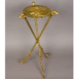 An unusual gilt brass tripod table The top formed as a horse's head through horseshoe,