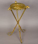 An unusual gilt brass tripod table The top formed as a horse's head through horseshoe,