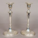 A pair of late Victorian silver candlesticks, hallmarked London 1898,