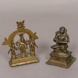 A small bronze figure of a Hindu priest Modelled at prayer;