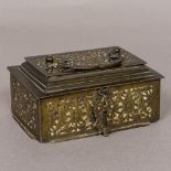A small 18th century bronze Middle Eastern bronze casket Together with two octagonal lidded boxes;