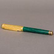 A FEDERICO BUCCELLATI 18K gold mounted ballpoint pen With spiral fluted cap and green marbled