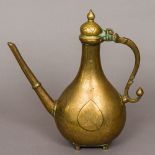 An 18th century Mughal bronze ewer With loop handle and elongated spout,