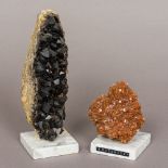 Two mineral specimens One aragonite, the other black quartz,