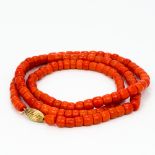 A single strand coral bead necklace Set with 18 ct gold clasp. Approximately 74 cm long.