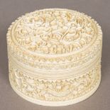 A late 19th century Cantonese carved ivory box Of lidded circular form,