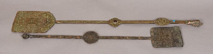 Two similar 19th century Tibetan temple implements The long copper shafts with spatulate ends.