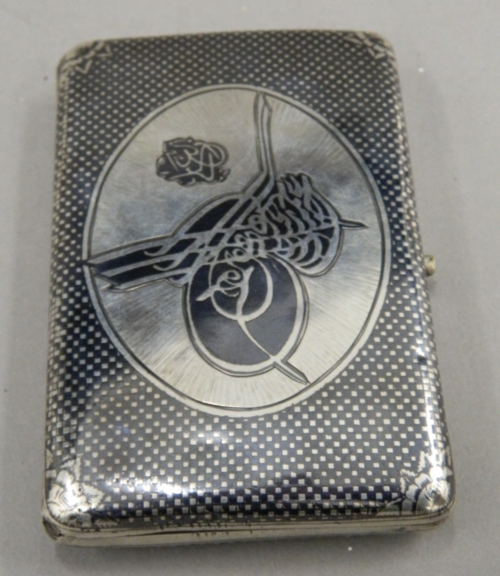 A 19th century Ottoman niello decorated silver cigarette case Of hinged rectangular form, - Image 2 of 6