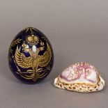 A Russian gilt heightened etched blue glass ornamental egg Decorated with the Russian double headed