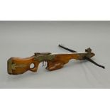 A 17th/18th century German style crossbow Formed from walnut, set with brass mounts. 88 cm long.