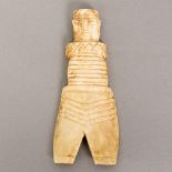An Egyptian bone Coptic doll With naturalistic face above the line carved body over the chevron