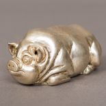 A silver pig Naturalistically modelled, the underside bearing Russian marks. 8 cm long.