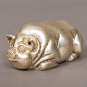 A silver pig Naturalistically modelled, the underside bearing Russian marks. 8 cm long.