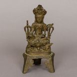 A Chinese antique bronze figure of Buddha Modelled seated wearing a headdress. 21 cm high.
